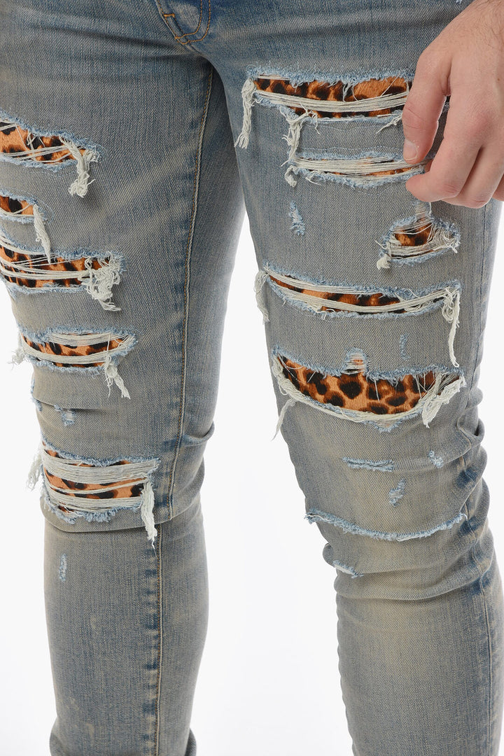 AMIRI SKINNY THRASHER DENIMS WITH LEOPARD DETAILS