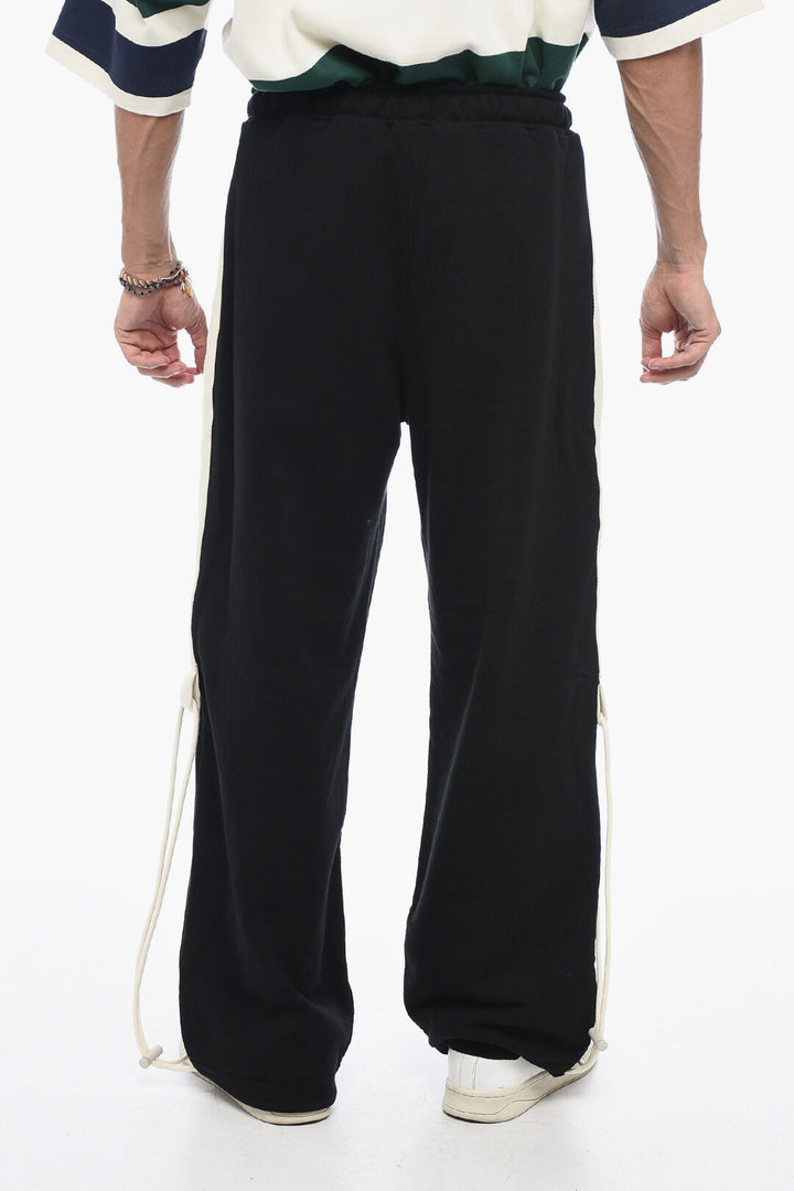 Pantaloni in cotone con coulisse e logo ricamato Palm Angels
