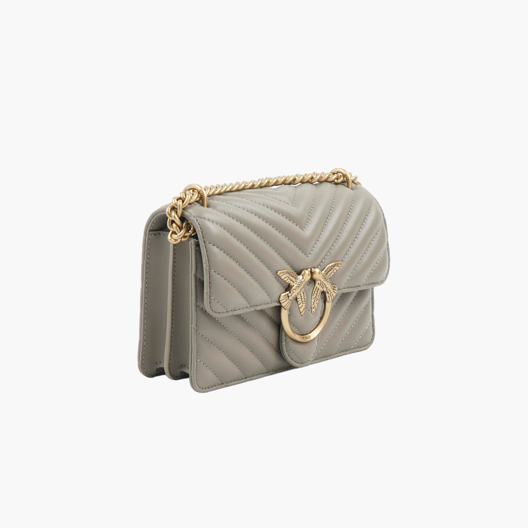 Borsa a tracolla trapuntata Pinko grigio-oro con tracolla a catena dorata e iconico logo dell'uccello